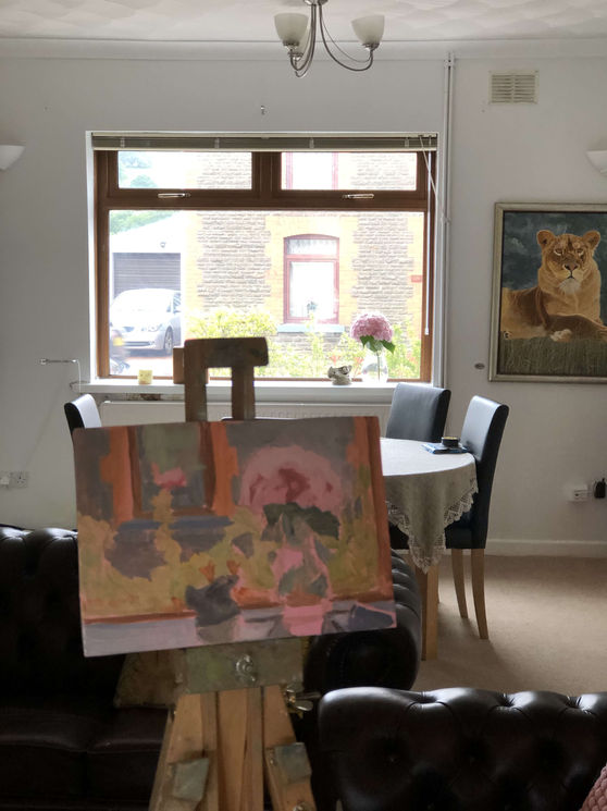 Photo taken at an early stage of the painting. It shows the panel on the easel in front of the subject.