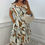 Thumbnail: Alma Printed Gem Stone Gold Button Magic Midi Dress Swirl