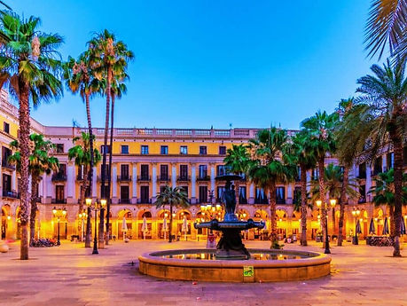 19th-century neoclassical square with Gaudí-designed lampposts, palm trees, and lively terraces.