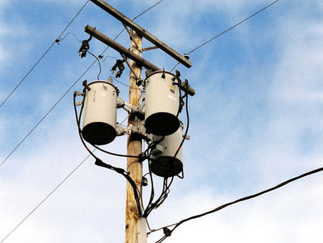 Utility pole and power lines representing electricity infrastructure in Rhode Island