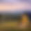 Thumbnail: A-frame cabin in a wide valley landscape at sunset.