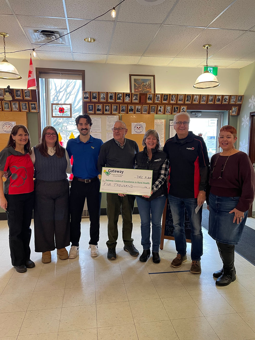 Legion and Gateway Staff pose for a picture with a cheque