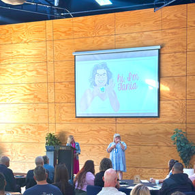 Tania speaking at the Faith & Biz Conference, sharing her personal journey.