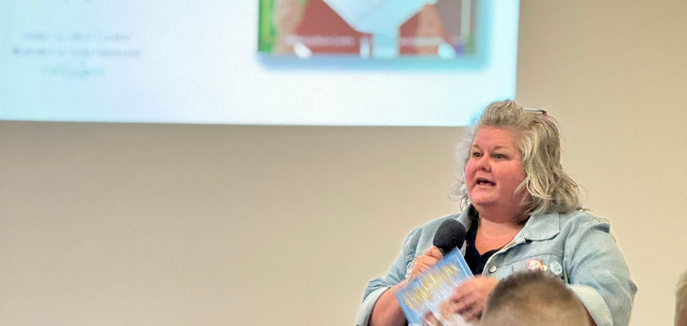 Tania speaking in front of an audience 