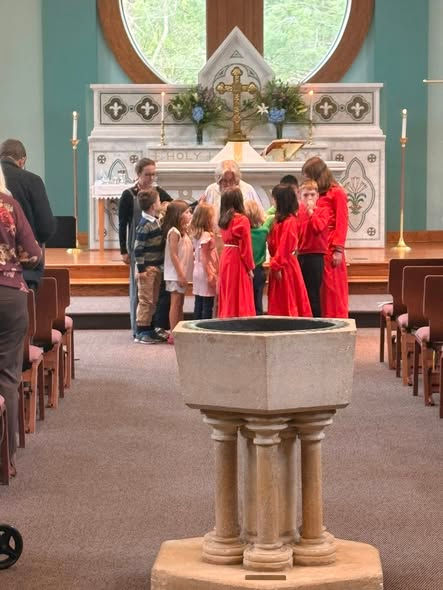 Children blessing Mother Nancy