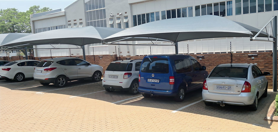White commercial shadeports covering multiple parking bays in Johannesburg