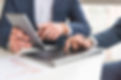 close-up-businessman-discussing-financial-report-digital-tablet.jpg