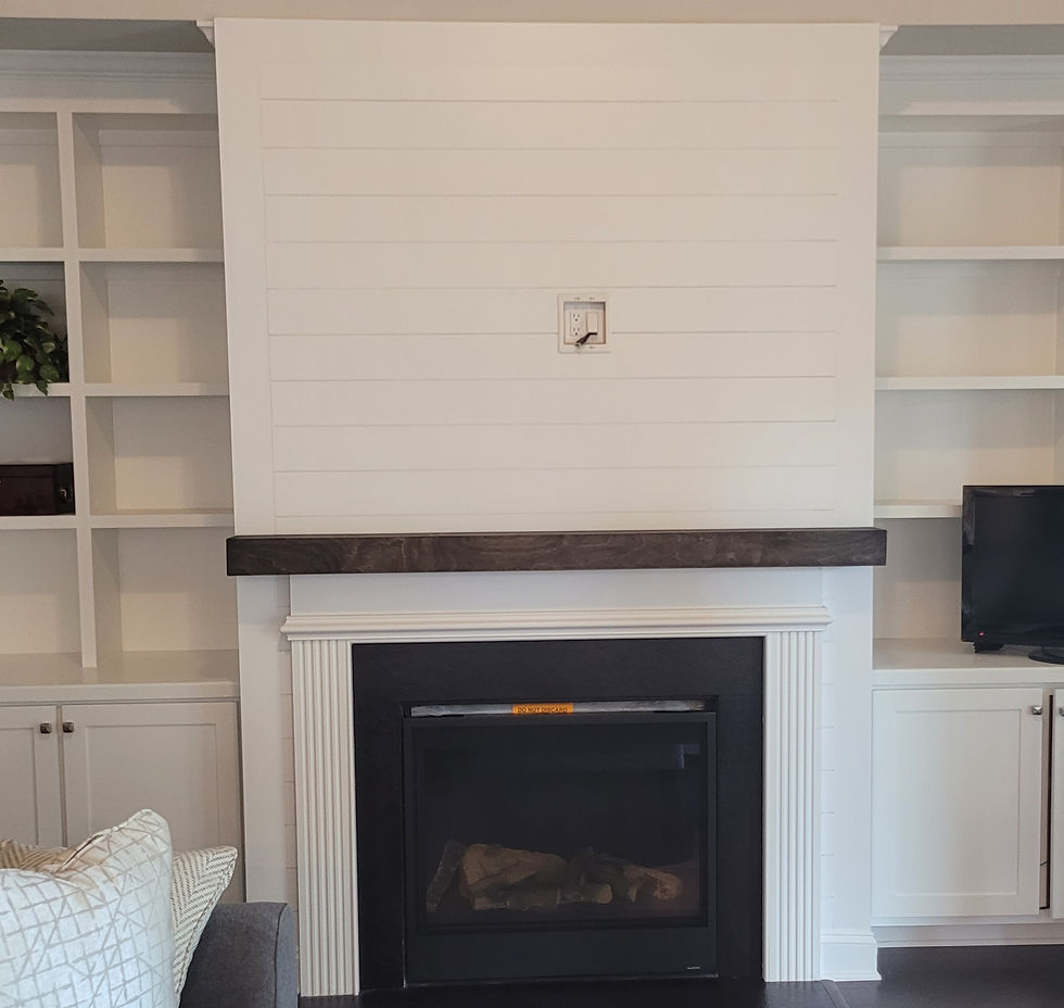 a fireplace surrounded by shiplap siding