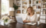 lady blonde hair sit behind desk typing with laptop resembles content writing services