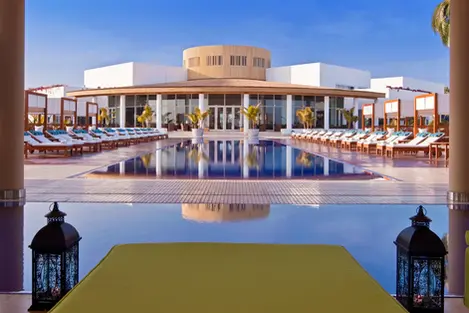 Elegant luxury hotel courtyard in Arequipa, Peru, built with white volcanic stone and colonial architecture.