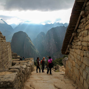 ravelers exploring an Inca archaeological site in Cusco.