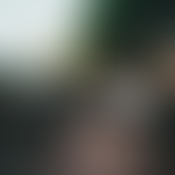 outdoor seating with cushions and hanging lights near grill on deck Design A Rose Interiors Chicago Create Your Personal Outdoor Oasis