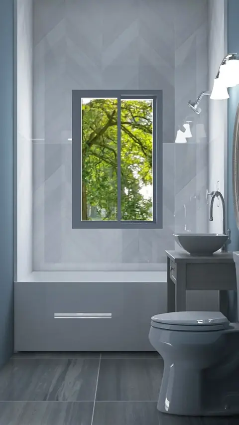 Contemporary bathroom with blue-gray tones, a vessel sink, herringbone tile walls, and a large window framing lush outdoor greenery. Designed by Design A Rose Interiors, a Black woman-owned Chicago design firm creating peaceful, high-end bathrooms that support both functionality and emotional well-being