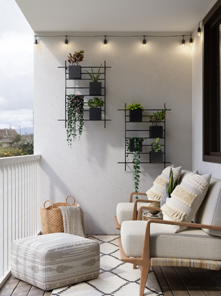 bright white covered patio with chairs plants hung on wall small sconces outdoor rug Design A Rose Interiors Chicago Create Your Personal Outdoor Oasis