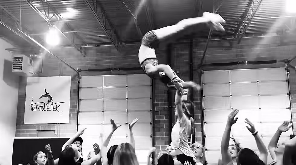 Cheerleaders perform high level cheer skills