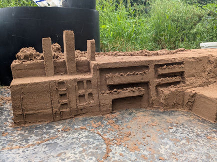 A rough sand sculpture of the Great Ormond Street Hospital cancer centre.