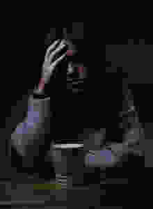 A woman in the dark representing Meniere's Disease symptoms, treated by audiology clinic High Level Speech & Hearing Center in Harahan, LA
