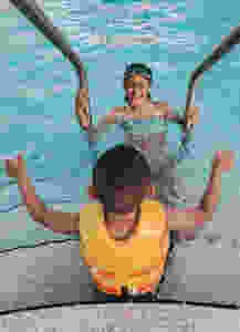 Two children playing in a pool