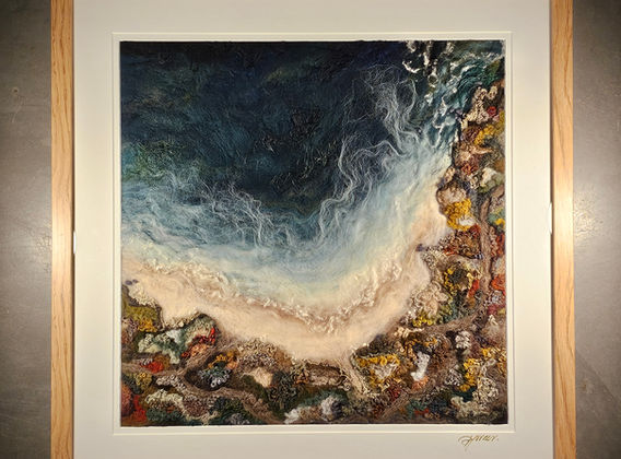 Fibre framed painting of coastline and rocks