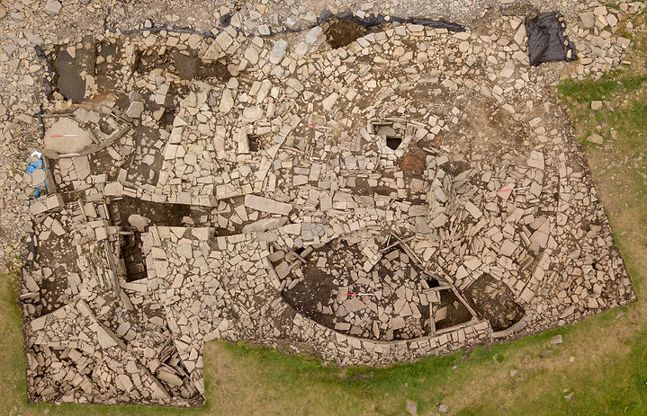 Drone photograph of the Late Bronze Age/Early Iron Age roundhouse and associated structures at the Knowe of Swandro, Rousay, Orkney.