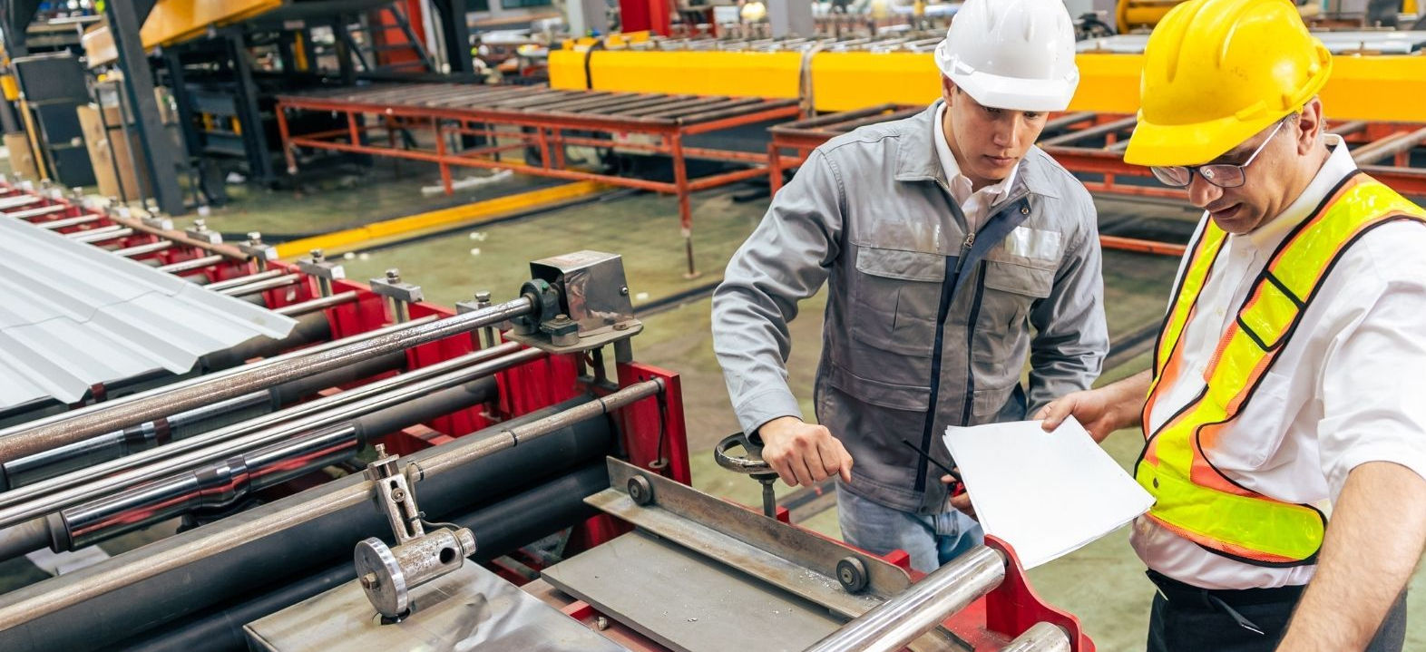 Engineer and foreman inspecting equipment