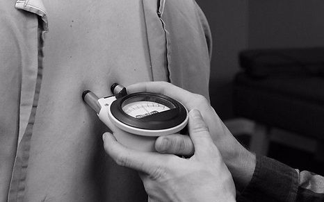 Man holding nervoscope gonsted technique chiropractic