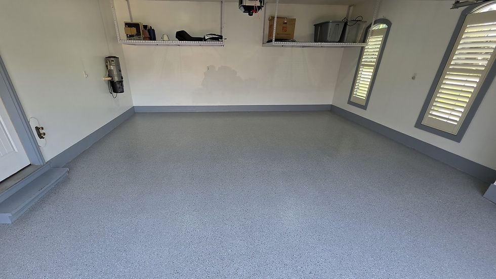 Gray flake epoxy garage floor with coated stem walls in Columbia, MO