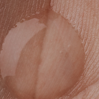 A hand with a squeeze of lube in the palm