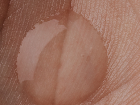 A hand with a squeeze of lube in the palm