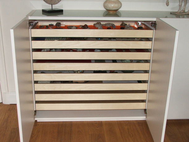 Minimalist white sideboard with bespoke interior for collection display