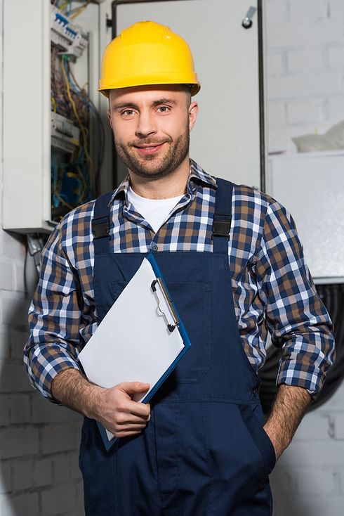 electrician-holding-clipboard-and-smiling-by-elect-2021-09-03-04-17-56-utc.jpg