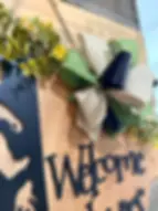 Wooden Bigfoot Welcome door hanger with bow