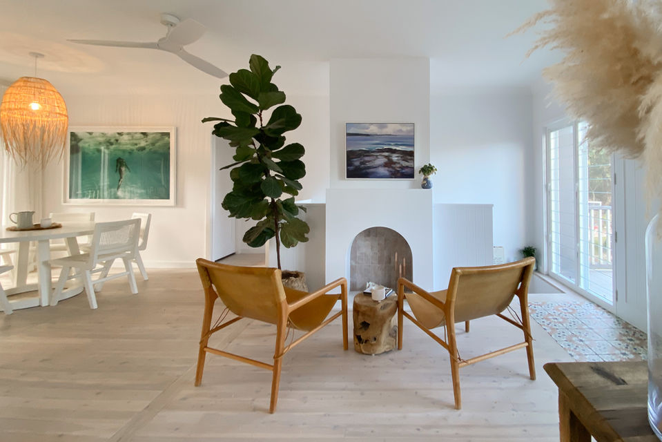 Open plan living space with custom arch fireplace