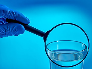 specialist examine or check water quality over blue background. eco friendly concept. test