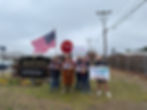 A group of people protesting outside the Plymouth County Correctional Facility with signs that say "Due Process is the Law."