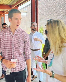Evan Francis speaking to a school administrator at Taunton Public Schools