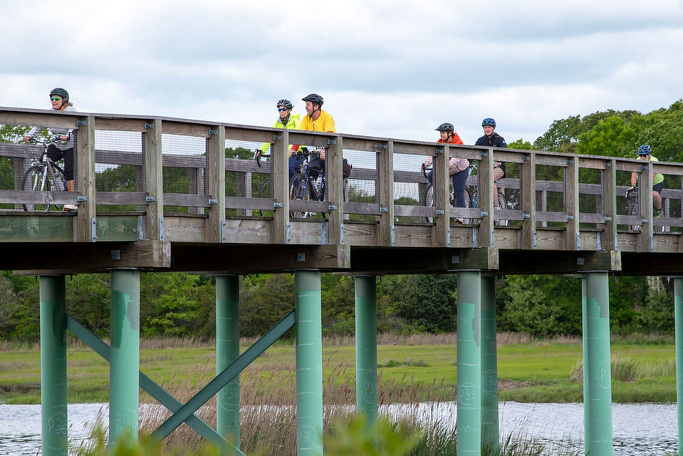group of people riding bikes in the new 1B portion of the Mattapoisett Bike Path