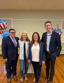 Group photo of Evan Francis with members of the Taunton City Council