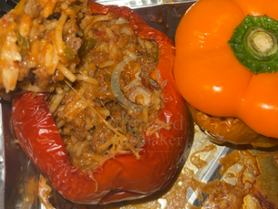 Bell peppers stuffed with rice and ground meat saucy mixture