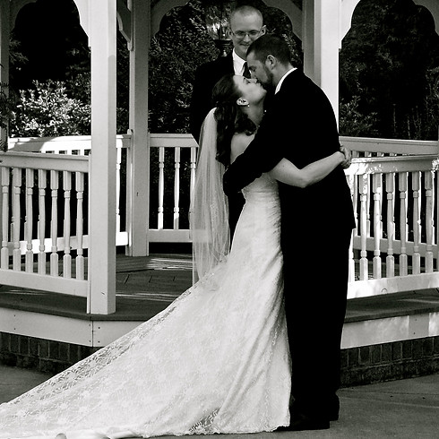 Newlyweds kissing at the alter, Isdell Photography, bride, groom, officiant, gazebo, wedding