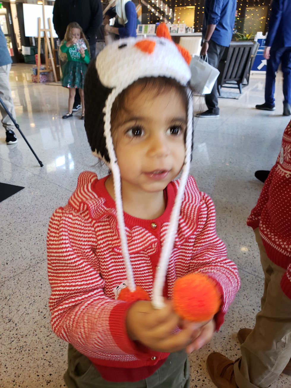 Little girl wearing a penguin hat