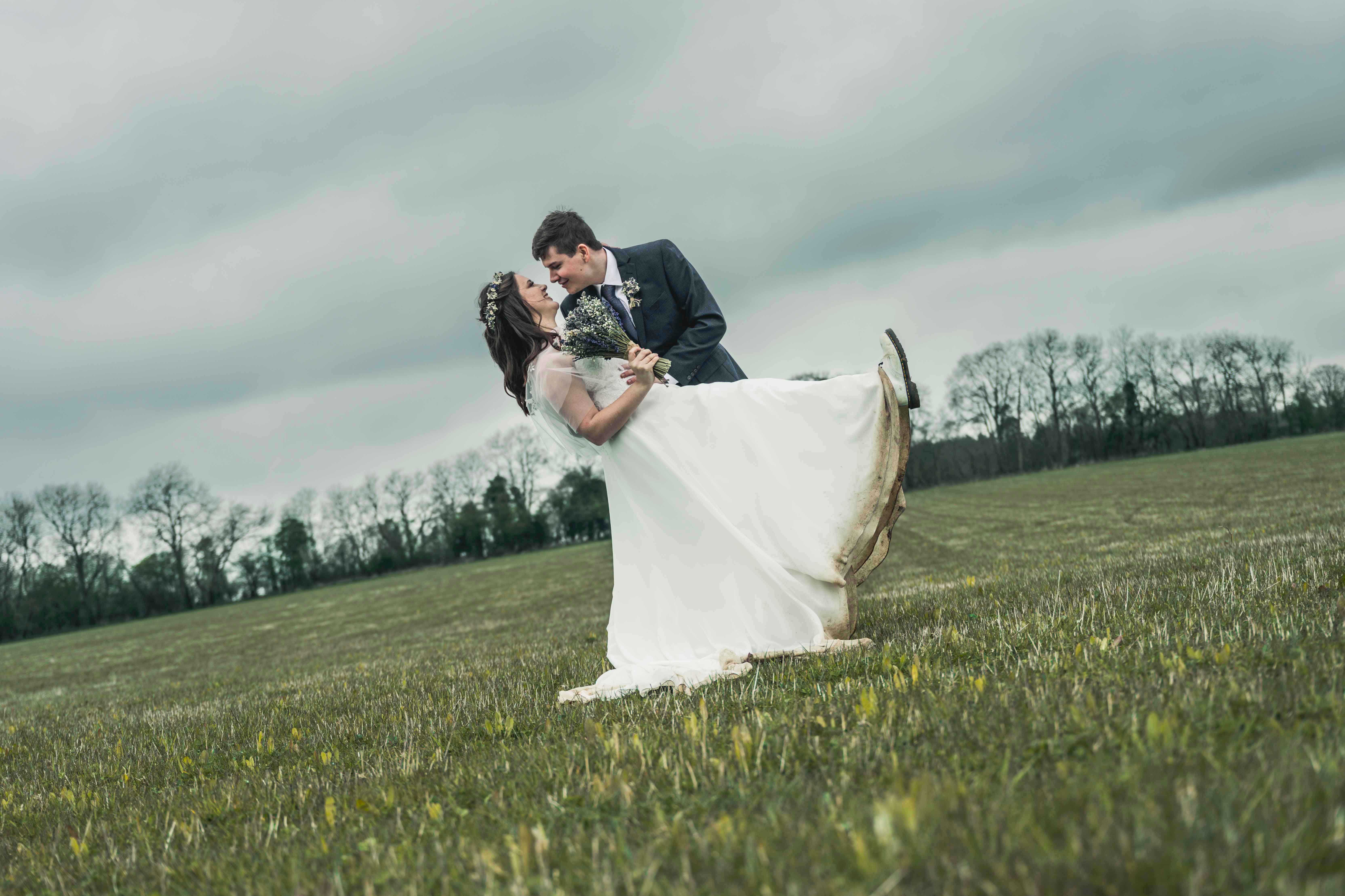 Wedding photographer reviewing a large professionally edited collection of more than one thousand wedding photographs