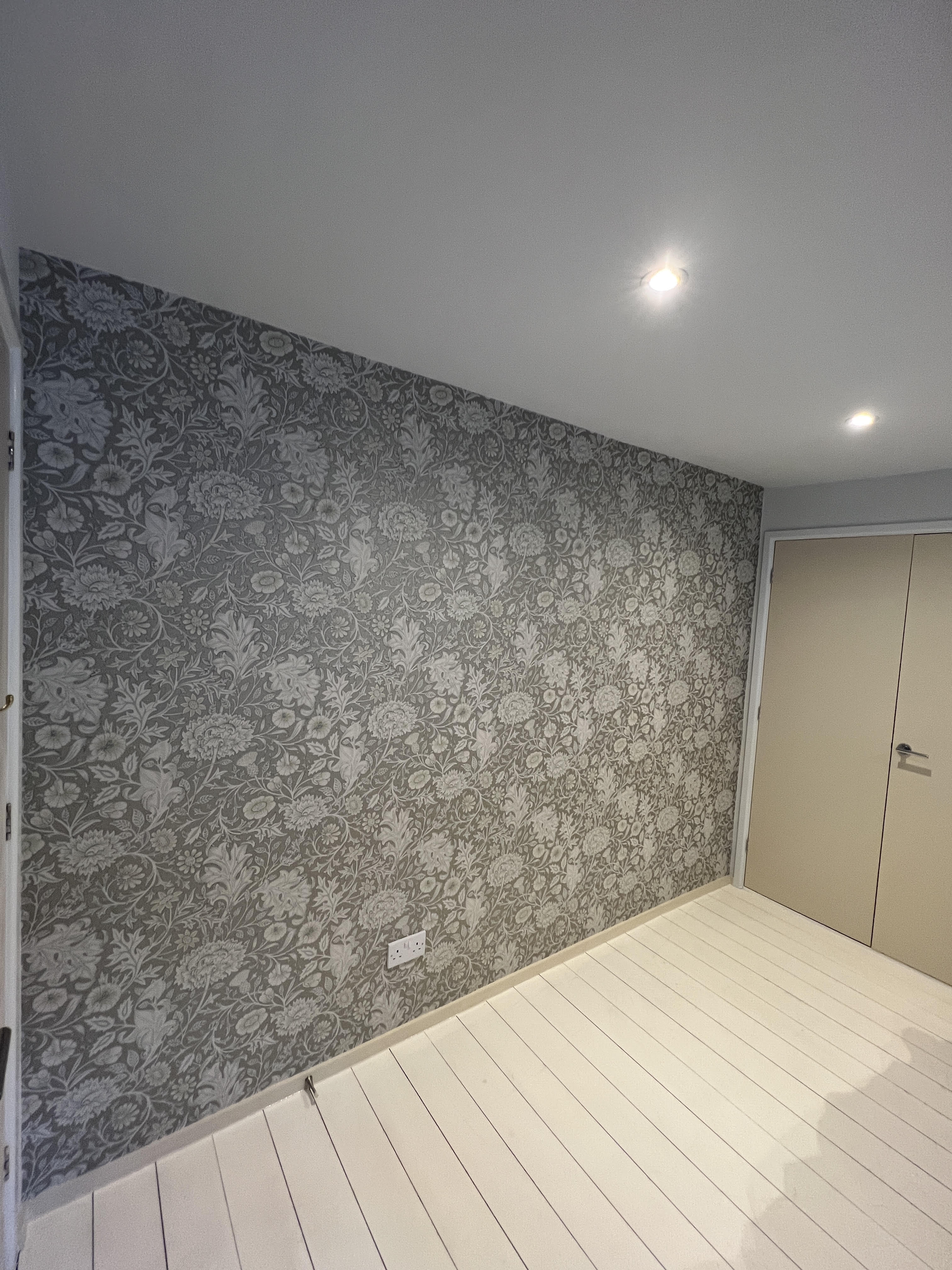 Patterned wallpaper installed neatly with aligned design and clean edges