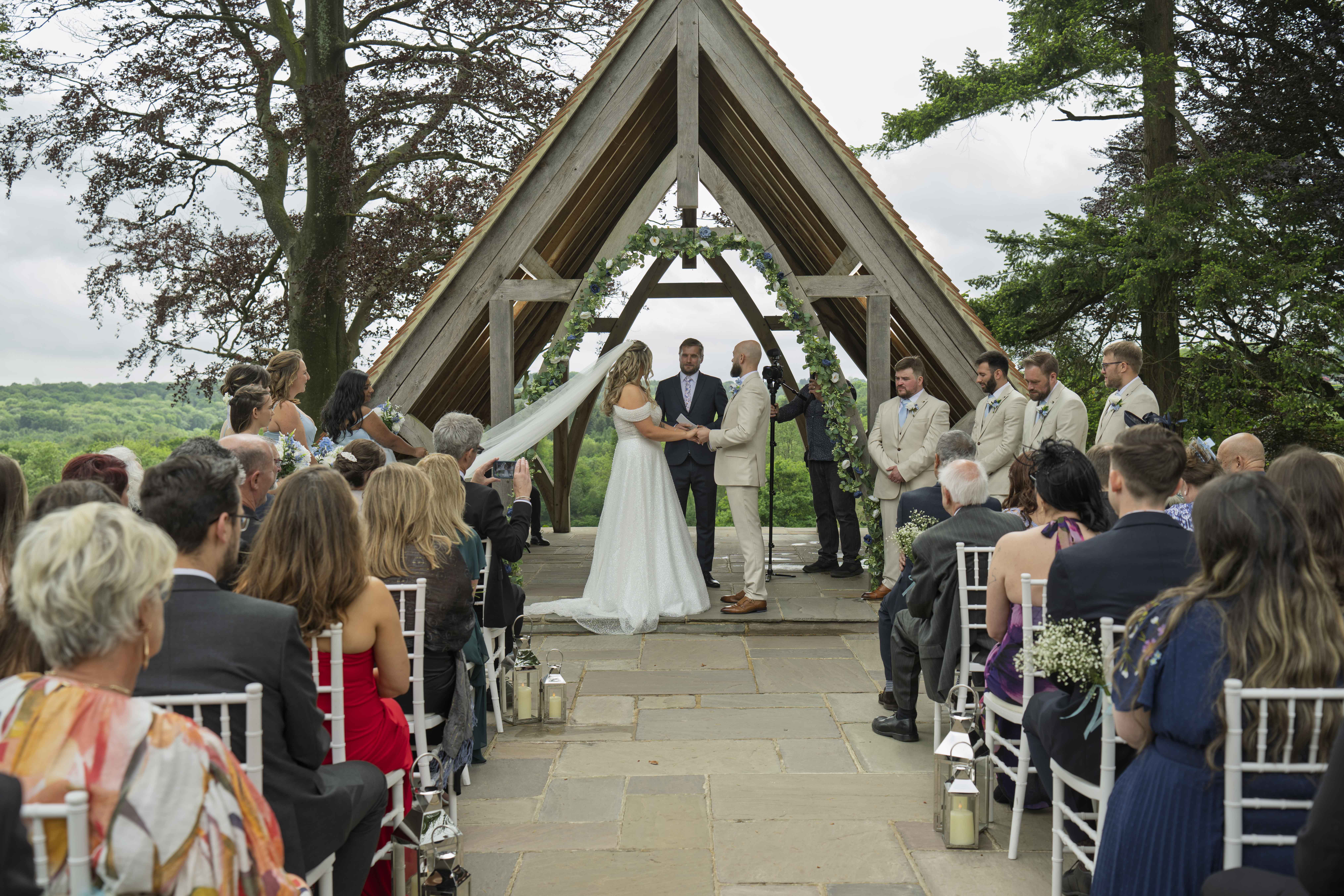 Large wedding celebration photographed by a coordinated professional photography team