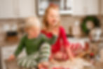siblings laughing and playing with flour on kitchen counter holiday photoshoot_Family Wall Portrait_Maryland family photographer_family photoshoot near me_studio photoshoot_Crystal Tseng Photography_Portrait Studio_Photo Studio_Ellicott City_Baltimore_Maryland_Washington DC