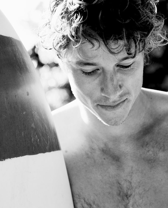 Close-up black and white photo of young man