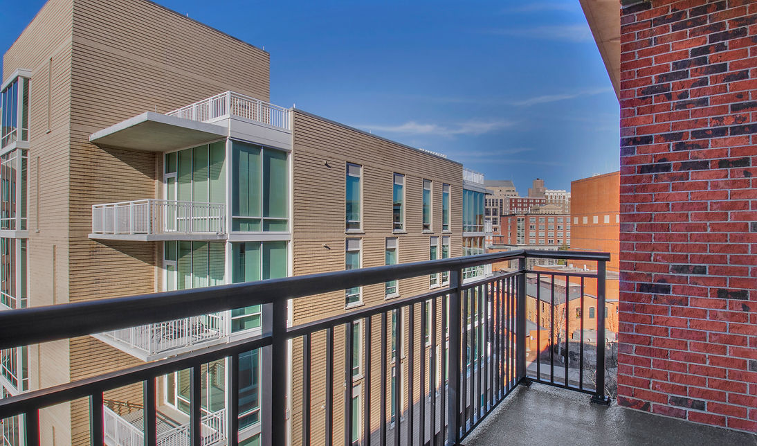 View of a Modern Condo from a Condo Balcony - Daniel Builders