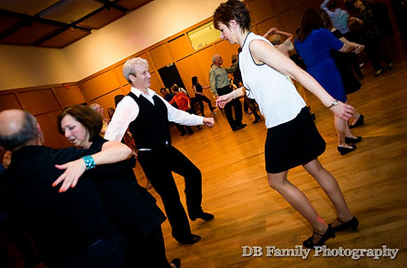 Couple enjoying dancing the Cha Cha on the ballroom dance floor at the Kalamazoo Institute of Arts, Kalamazoo, Michigan.