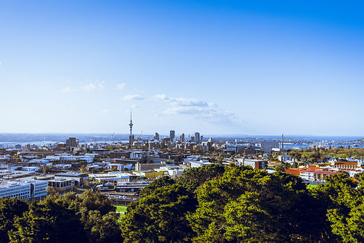 high-angle-view-buildings-sea-against-blue-sky.jpg