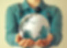 Woman holds glass earth in her hands_edited.jpg